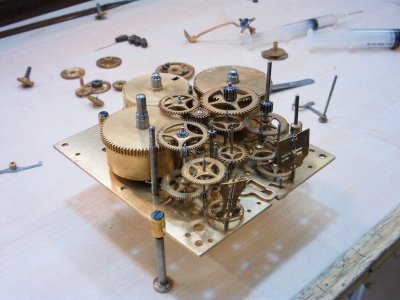 A clock movement being assembled